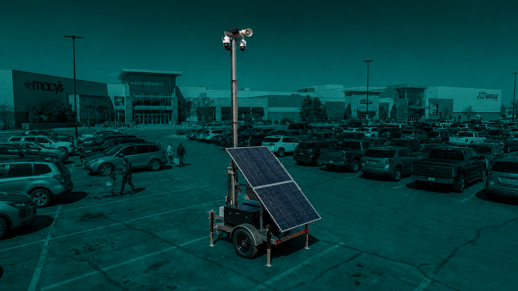 Solar-powered security trailer monitoring a retail parking lot